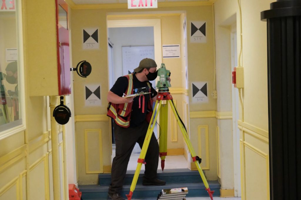 Set up of survey network during the digital documentation of Old Sun Community College in August 2020. Photo Source: Madisen Hvidberg.