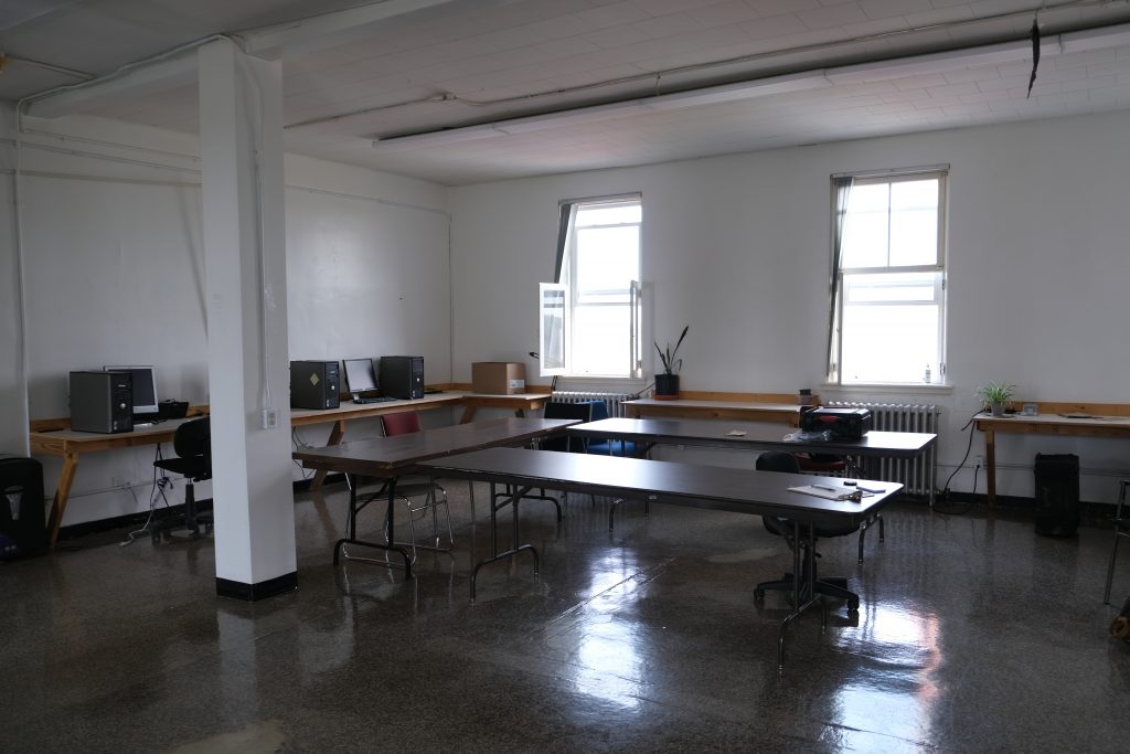 UnBQ computer room and workspace, formerly the junior boys' dormitory. Taken during digital documentation, August 2021. From Zoe Cascadden.