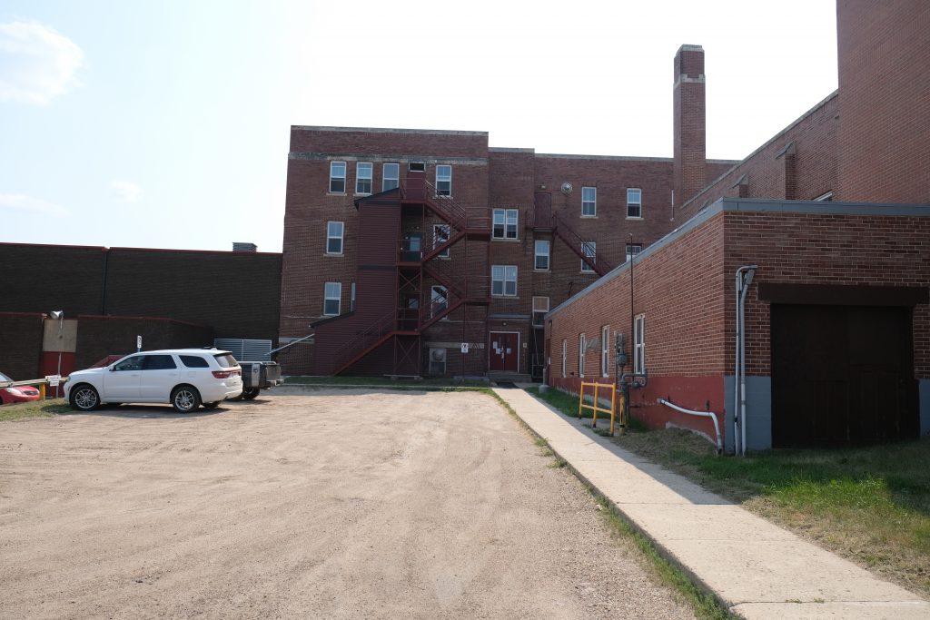 Exterior of Blue Quills during digital documentation. At the back of the school on the boys' side, August 2021. From Madisen Hvidberg.