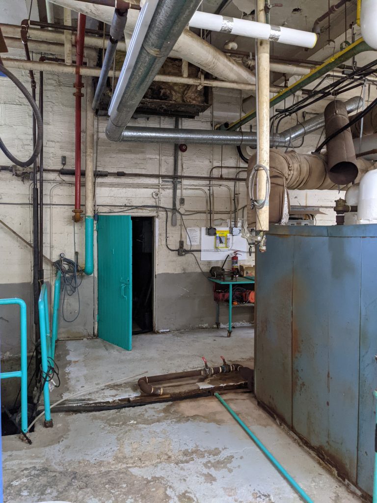 UnBQ boiler room, largely unchanged since its time as a residential school. Taken during digital documentation, August 2022. From Madisen Hvidberg.