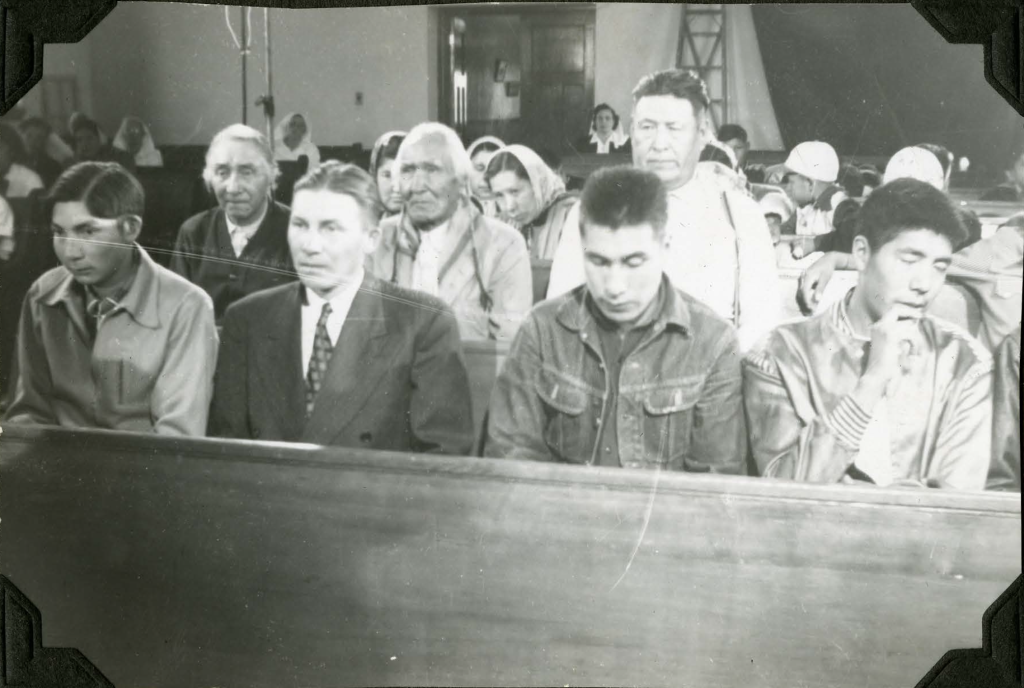 Community members in chapel during filming of a movie. 1952. Shingwauk Residential Schools Centre, Algoma University.