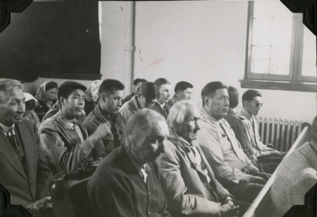 Community members in chapel during filming of a movie. 1952. Shingwauk Residential Schools Centre, Algoma University.