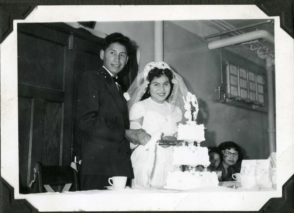 Aileen Ayoung Man, former Old Sun student, and Horace Gladstone have their wedding dinner in Old Sun dining room, 1949. Shingwauk Residential Schools Centre, Algoma University.