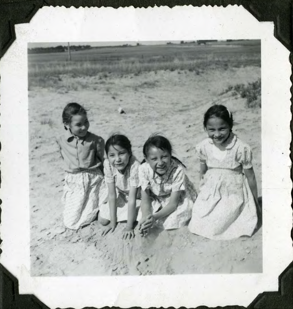 When the weather was nice, students would sometimes be brought by staff for recreational time around the school grounds, like these nearby sand dunes. Early 1950s. Shingwauk Residential Schools Centre, Algoma University.