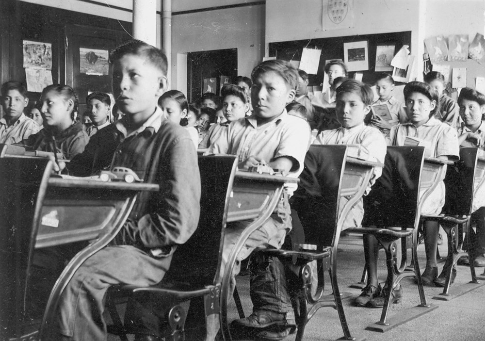 Senior classroom. Photo consists of students sitting at their desks, in view from front of classroom to the rear- 1945. P75-103-S7-184 from The General Synod Archives, Anglican Church of Canada