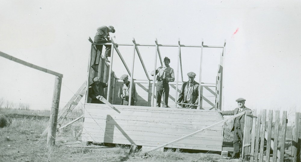 Students spent much of their time doing maintenance and chores for the school. Here, workshop boys build a brooder house. [194-?]. P75-103-S7-192 from the General Synod Archives, Anglican Church of Canada.