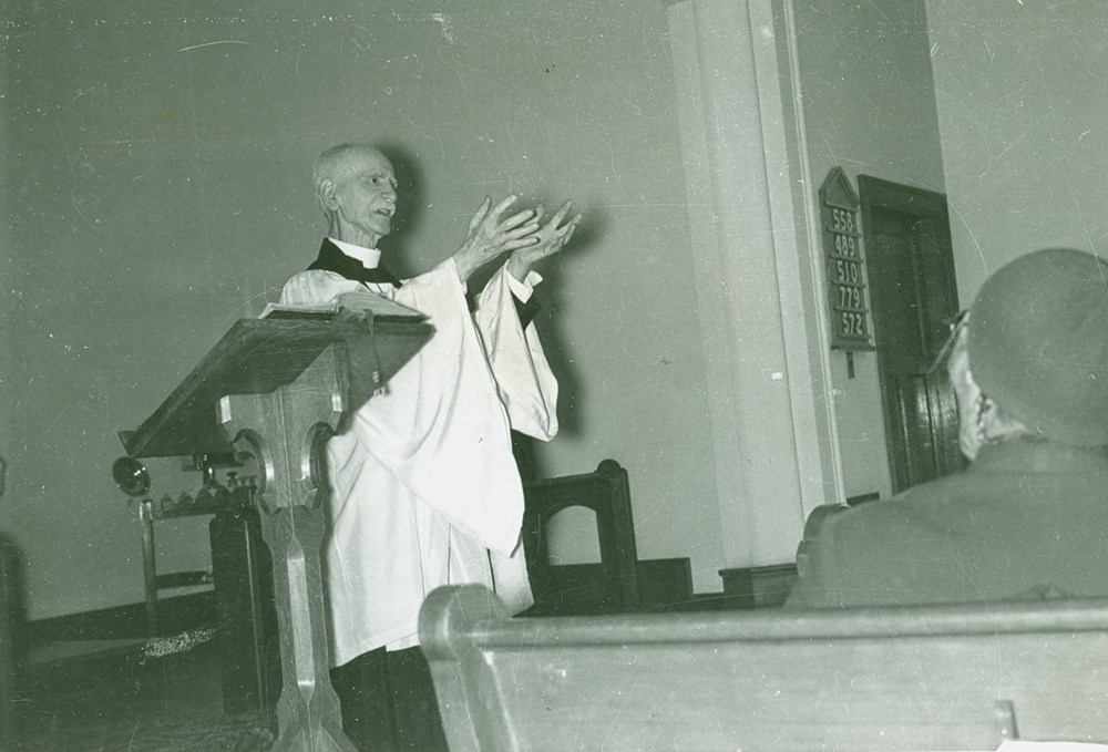 Canon Gibbon Stocken conducting service at Old Sun School. - [ca. 1949]. P75-103-S7-198 from The General Synod Archives, Anglican Church of Canada