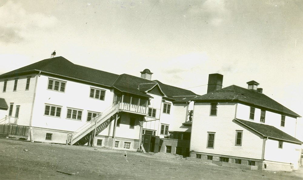 Blackfoot Old Sun School, Gleichen, Alberta - southwest view of main building. - [192-?]. P7538-672 from The General Synod Archives, Anglican Church of Canada.