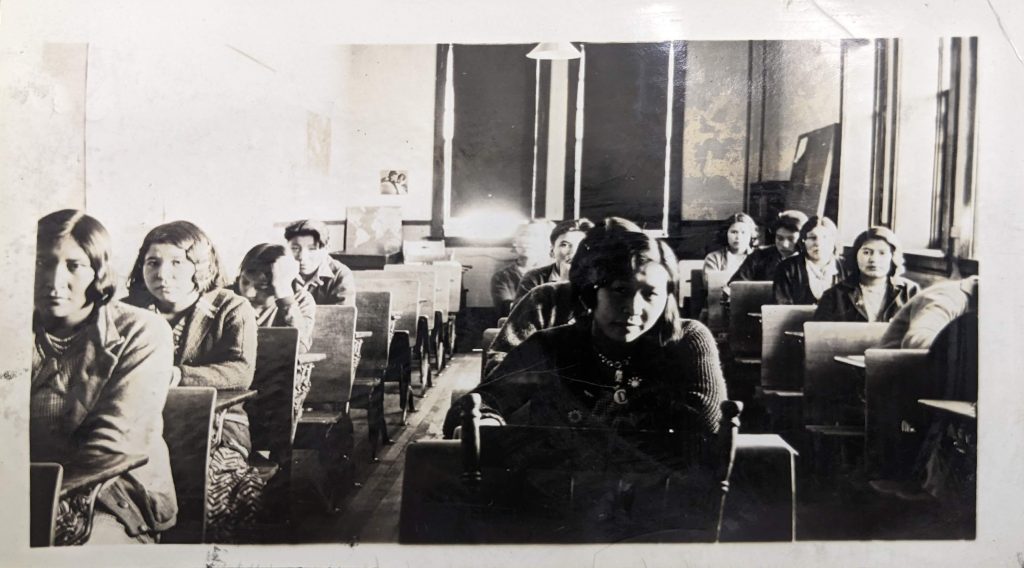 Grade 6 students seated in a classroom, between 1926-1937. PR1985.0100 from The Provincial Archives of Alberta, Open Copyright.