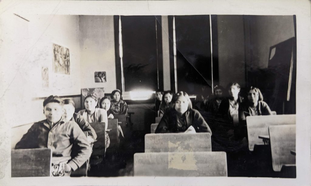 Grade 6 students seated in a classroom, between 1926-1937. PR1985.0100 from The Provincial Archives of Alberta, Open Copyright.