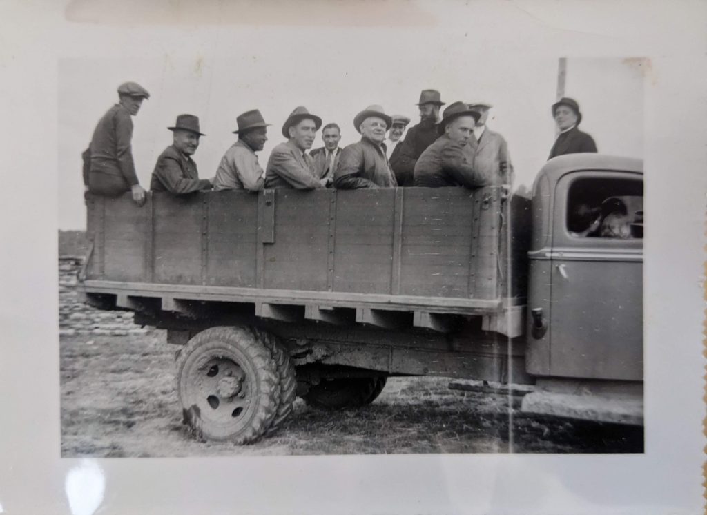 Staff or visitors in a granary truck, which would have been used for work around the school grounds as well as for picking up students to bring to the residential school. Date unknown, likely 1950s. PR1973.0248/287 from The Provincial Archives of Alberta, Open Copyright.