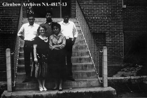 Mildren Richardson (teacher) and grade 9 students after final exams, Donna Jean Bear Chief in the front. 1956. NA-4817-13. Courtesy of Glenbow Archives .