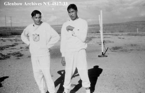 Randy Young Man (left) and Adrian Stimpson (right). Possibly at sports days at Old Sun School. 1955-1957. NA-4817-33. Courtesy of Glenbow Archives .