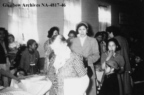 Bazaar, Old Sun School. Amy Smith in hat. 1955-1957. NA-4817-46. Courtesy of Glenbow Archives .