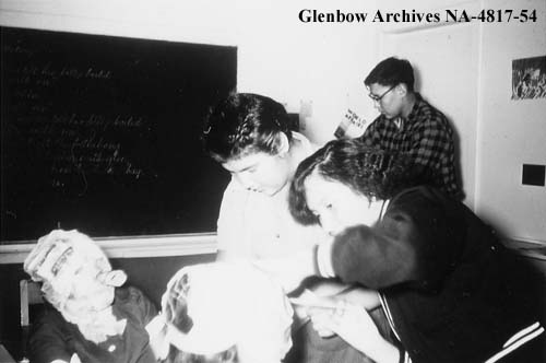 Making paper mache masks for Halloween. 1955-1957. NA-4817-54. Courtesy of Glenbow Archives .