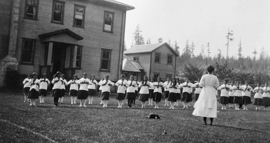 Marie Gibney and students at the earlier, wooden Old Sun School 1924-1925. NA-5022-10. Courtesy of Glenbow Archives.