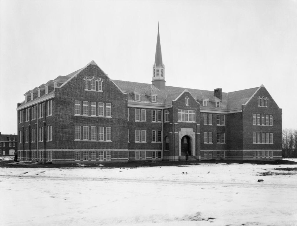 Edmonton Indian Residential school, 1924. Carriage house visible to the left. CU155958 by McDermid Studio. Courtesy of  Collection, Libraries and Cultural Resources Digital Collections, University of Calgary.